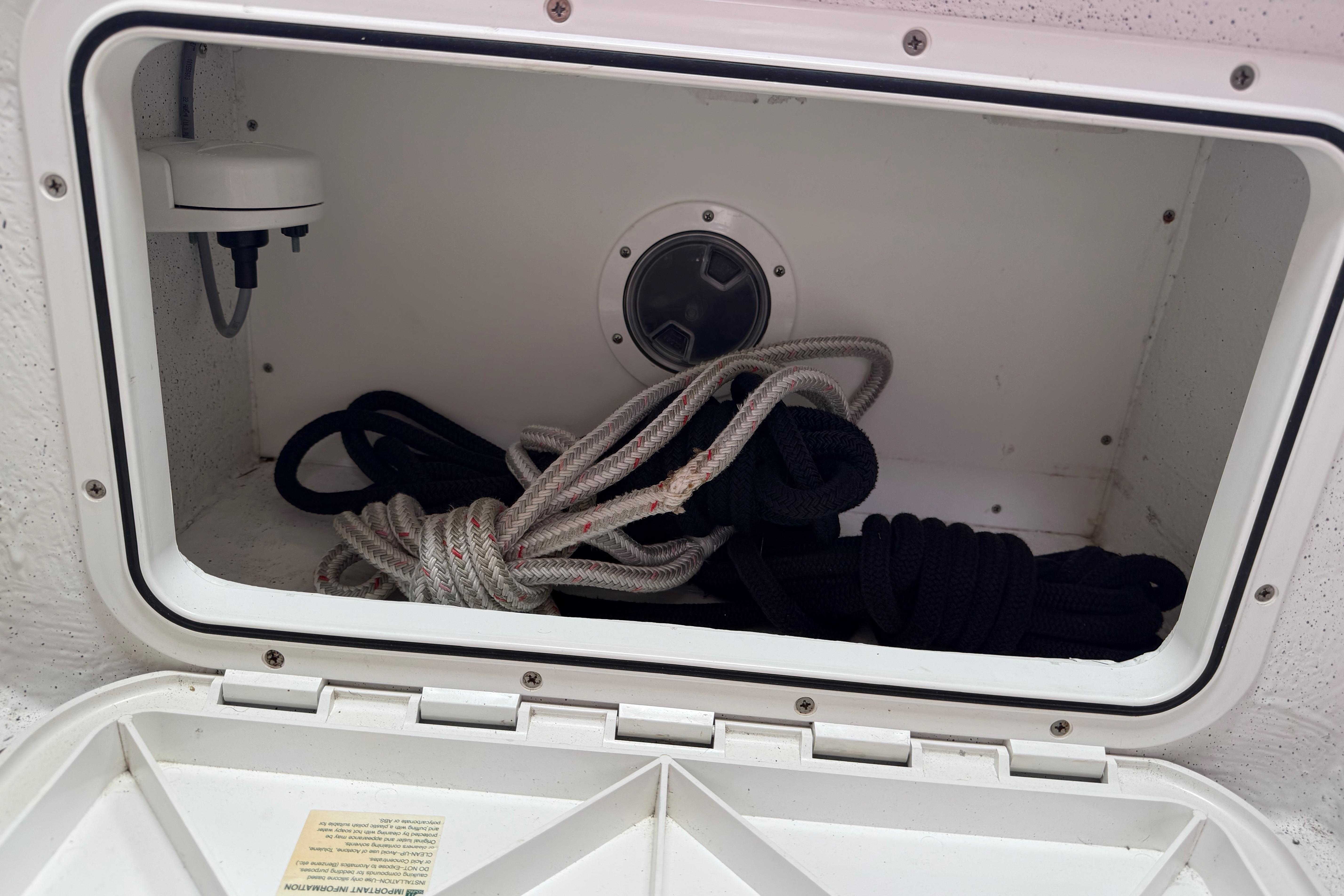 Storage compartment with ropes on a 2016 Protector Targa 30 boat.