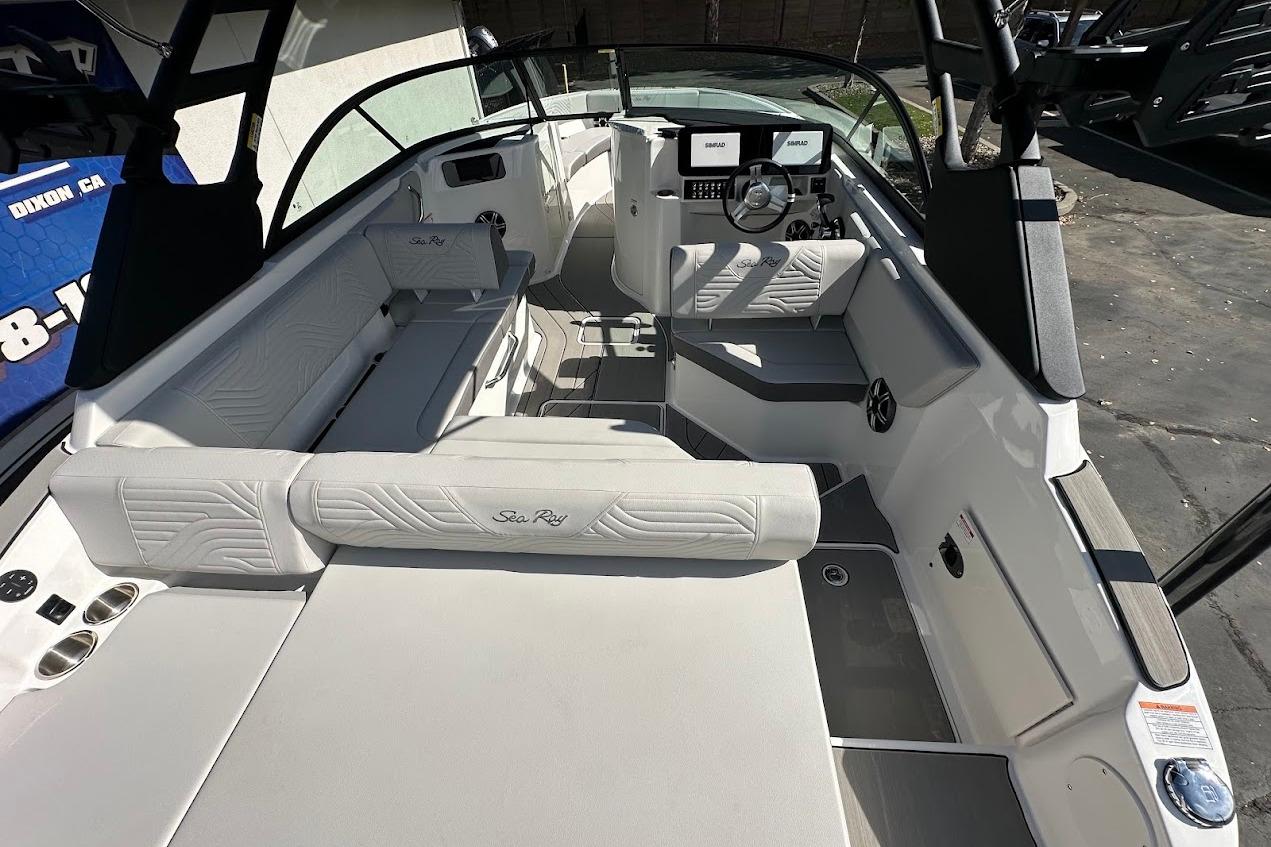 2026 Sea Ray SDX 230 Surf boat interior with modern seating and dashboard.