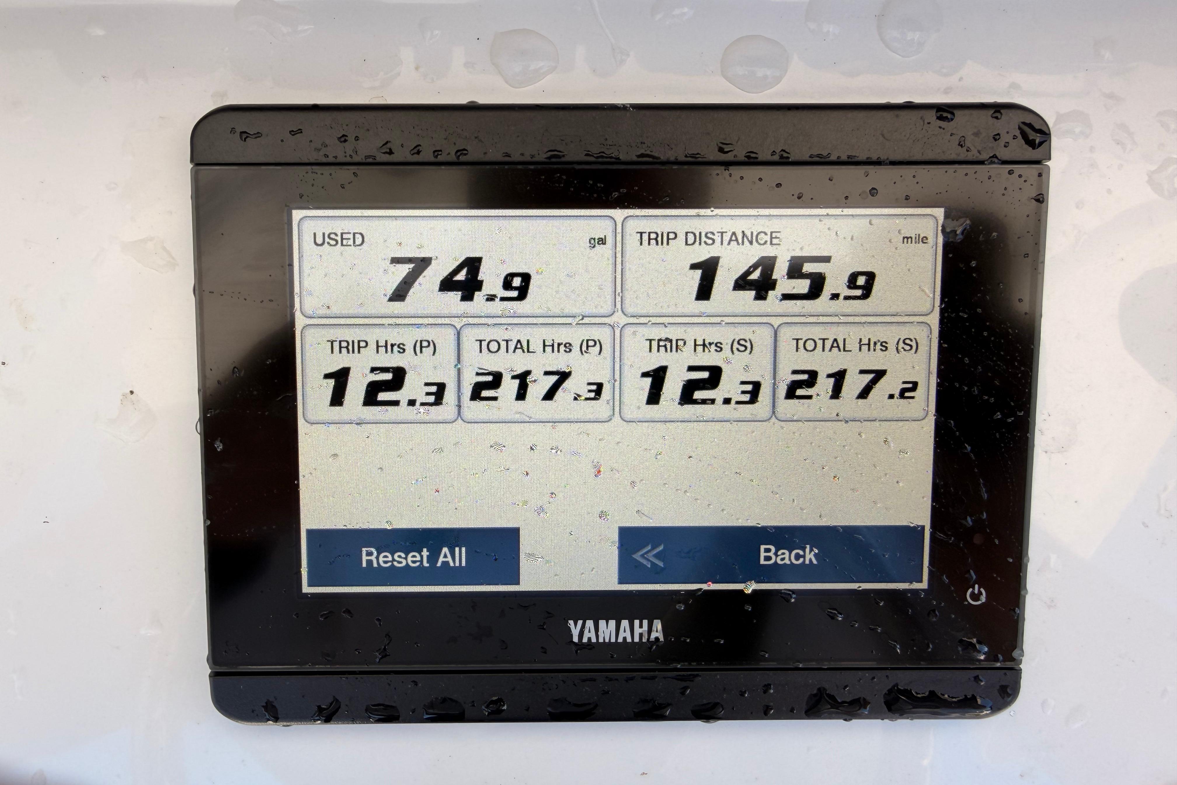 Yamaha display showing fuel usage and trip data on 2024 Sea Hunt Gamefish 27 Coffin Box.