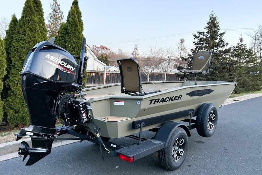 2026 Tracker Grizzly 1650 T Prairie Wings Edition boat on trailer with Mercury outboard motor.