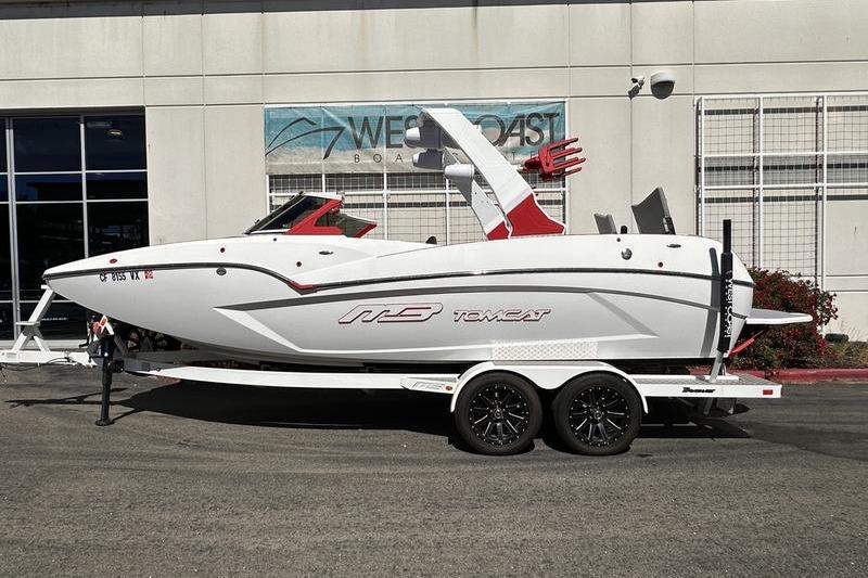 2023 MB SPORTS F22 Tomcat Alpha boat on trailer outside dealership.