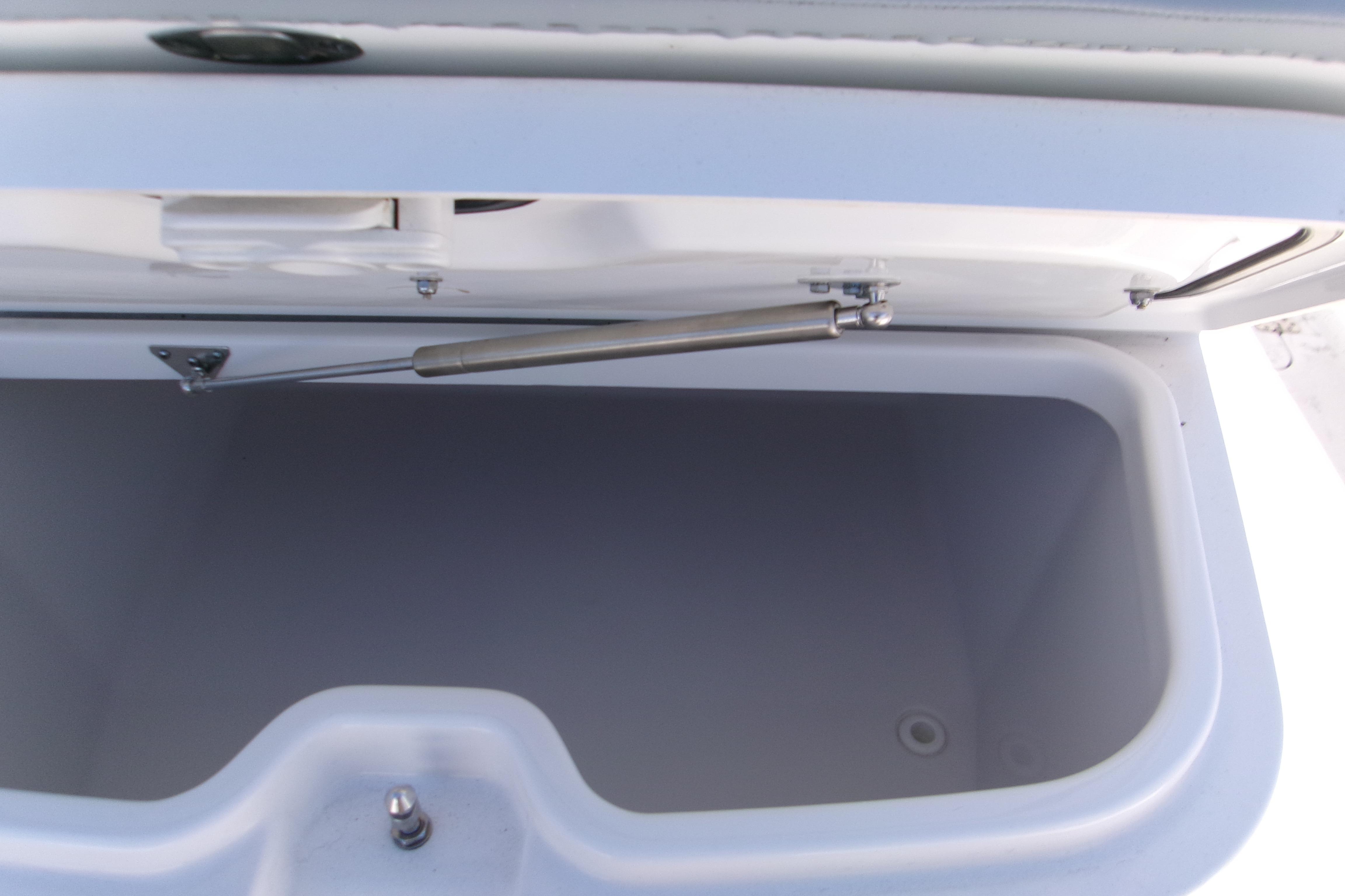 Open storage compartment on 2026 Sportsman Heritage 321 Center Console boat.