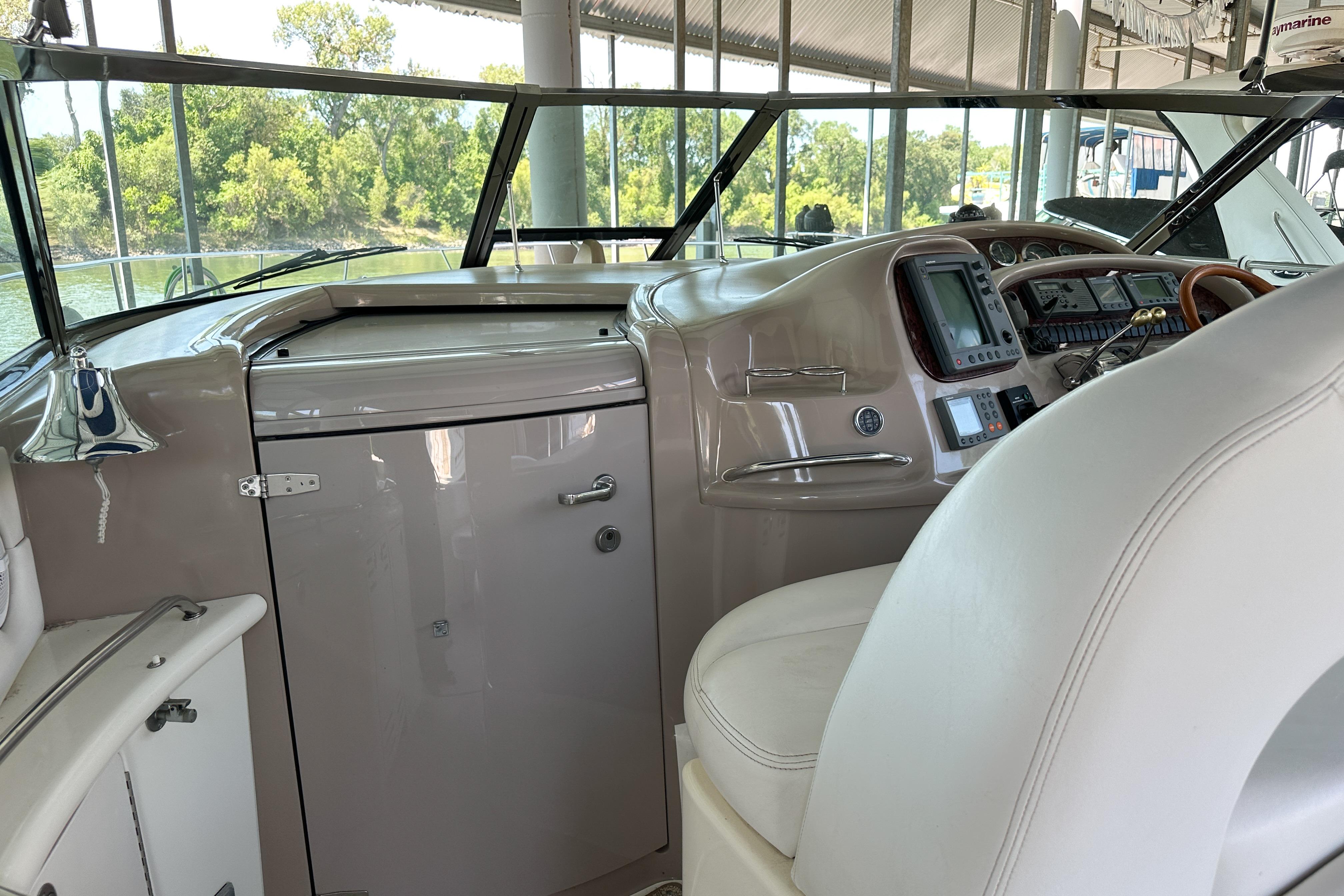 Interior helm of 2001 Sea Ray 410 Sundancer yacht with navigation equipment.