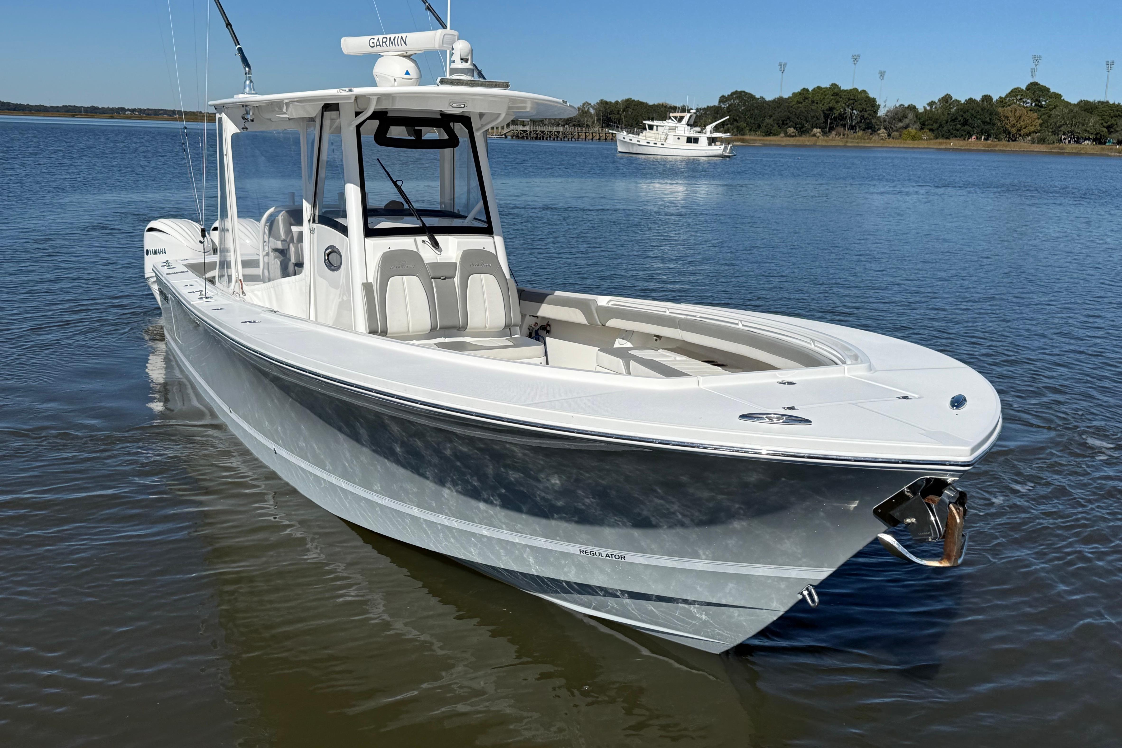 2022 Regulator 34 boat on calm water with clear blue sky.