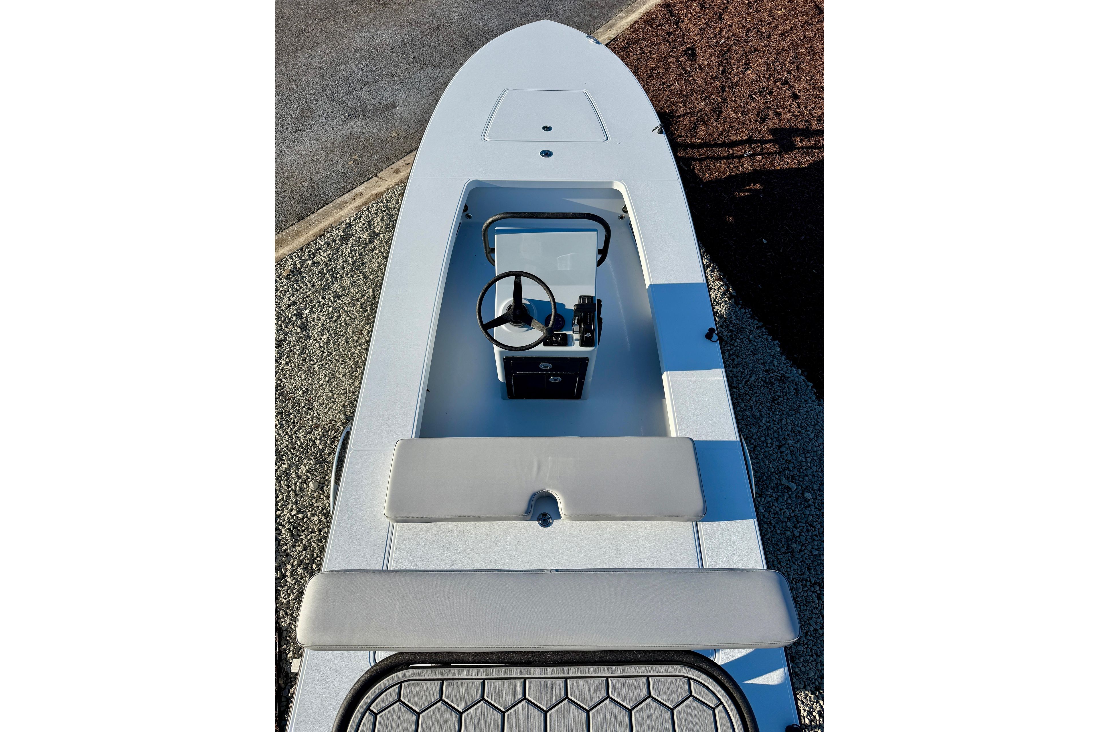 2026 East Cape EVO 17V boat interior with steering console and seating.