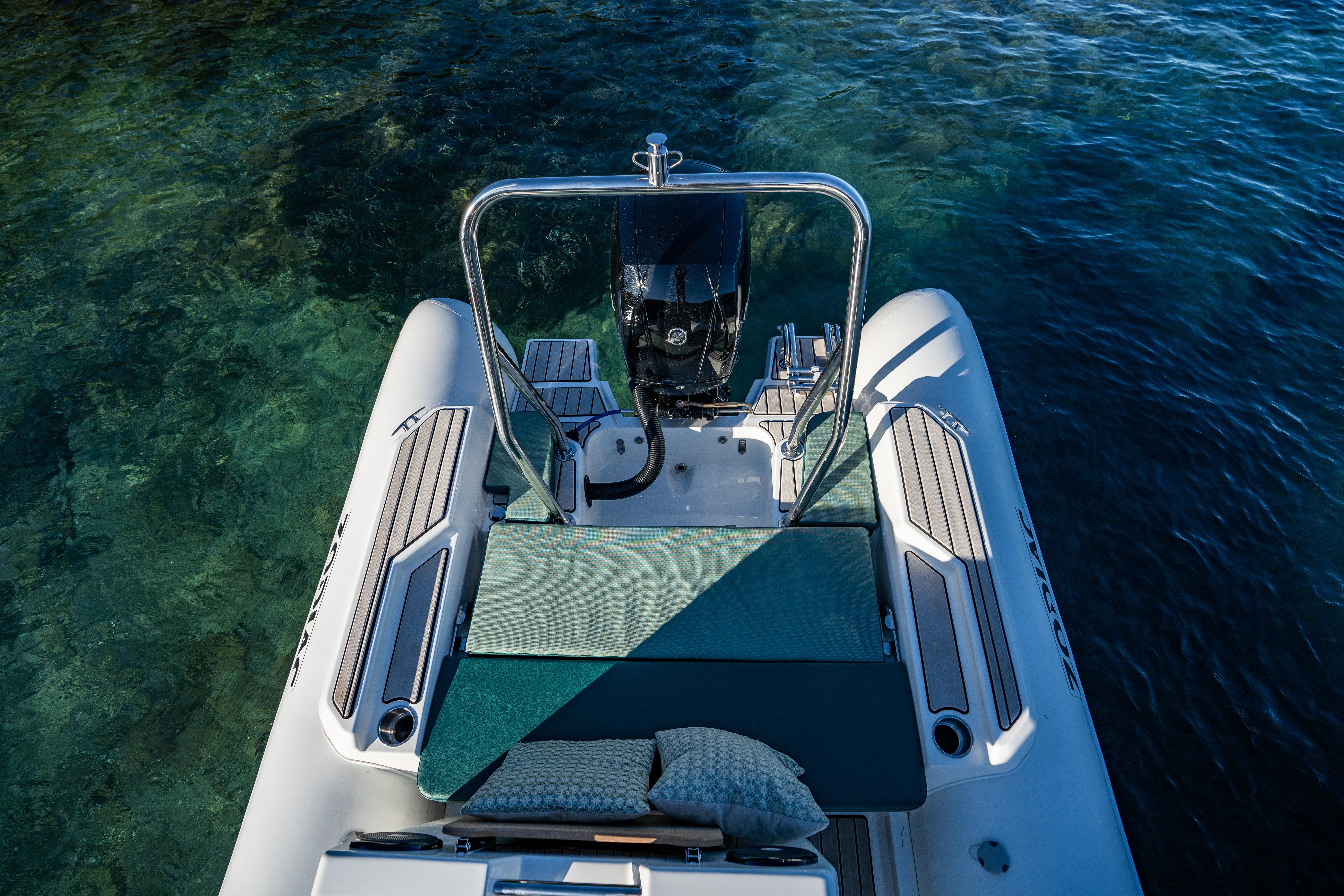 2025 Zodiac Medline 5.8 NEO boat on clear water, featuring a sleek design and comfortable seating.