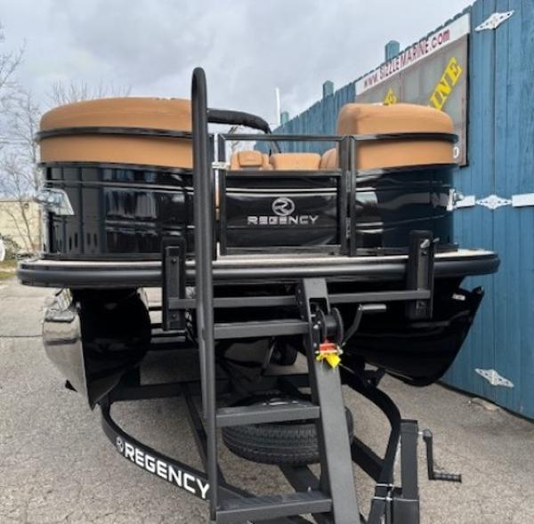 2025 Regency 230 LE3 pontoon boat on trailer, black with tan seats.