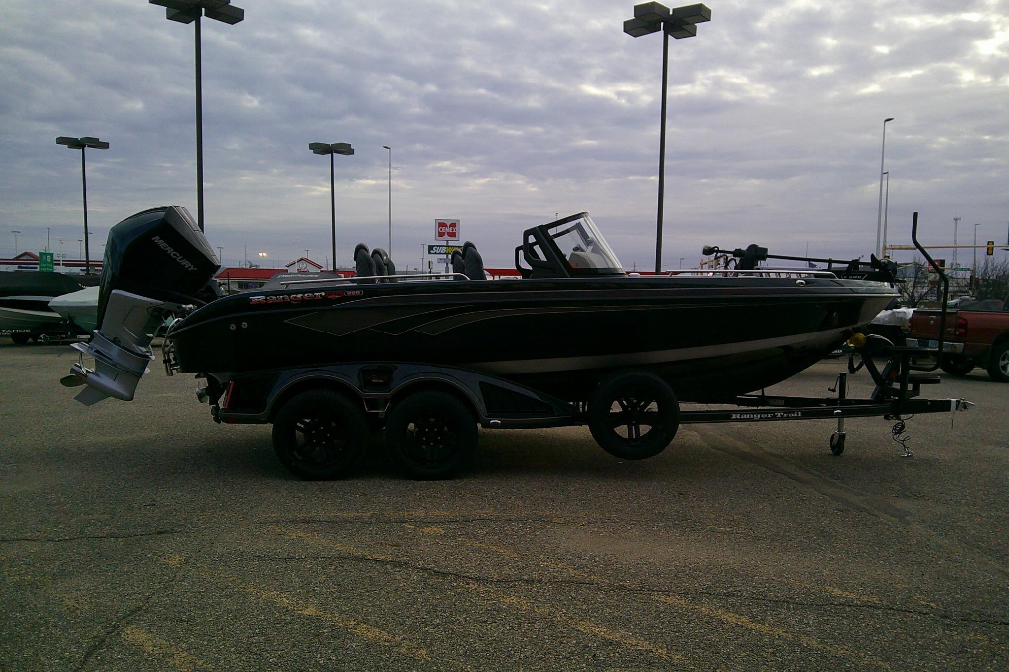 2026 Ranger 620FS Pro boat on trailer in parking lot under cloudy sky.