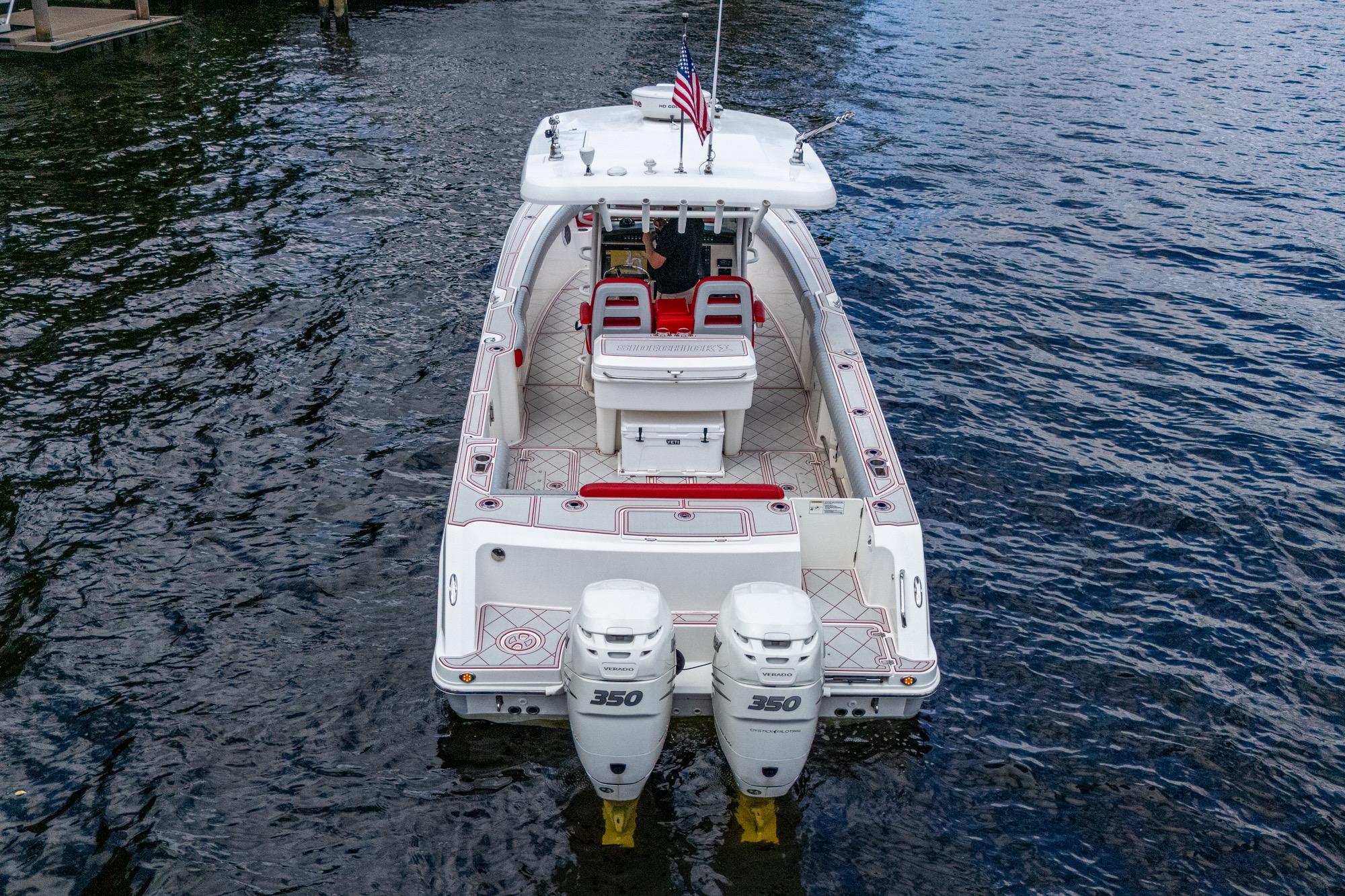 2018 Boston Whaler 330 boat with twin 350 engines on water.