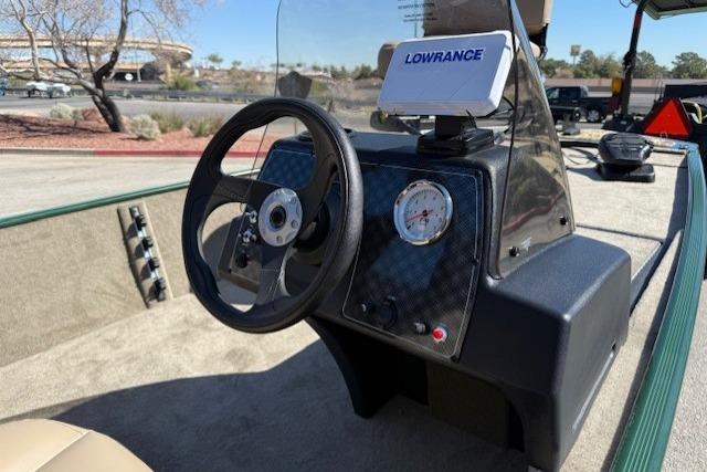 2026 Tracker Bass Tracker Classic Limited boat dashboard with steering wheel and Lowrance navigation system.