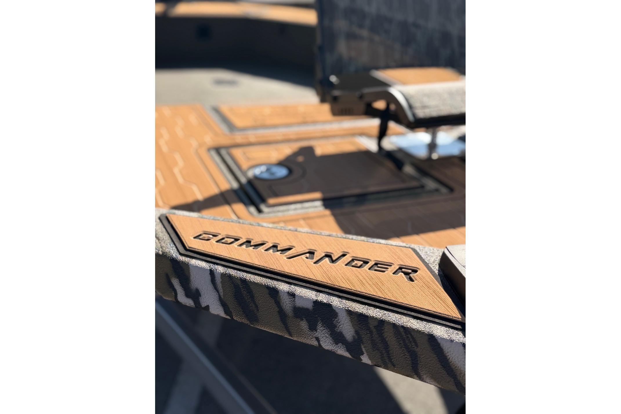 2026 Avid 18 Commander boat deck with "Commander" branding in focus.