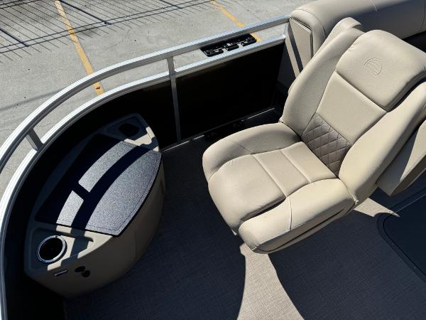 2025 Sun Tracker 24 Sportfish XP3 boat interior with beige seating and console.