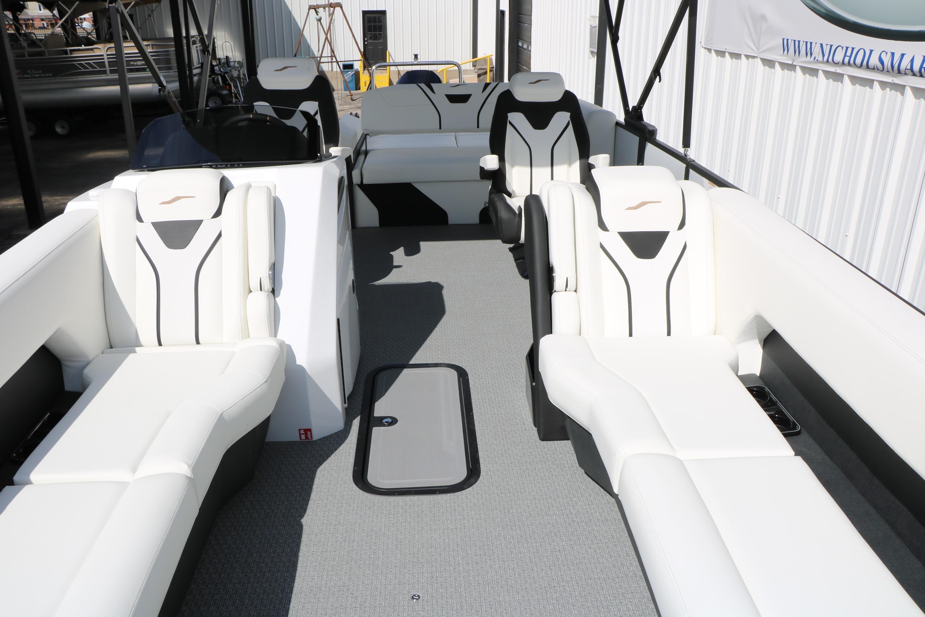 Luxurious interior of 2026 Evotti 725 CS Tri-Toon boat with modern seating design.