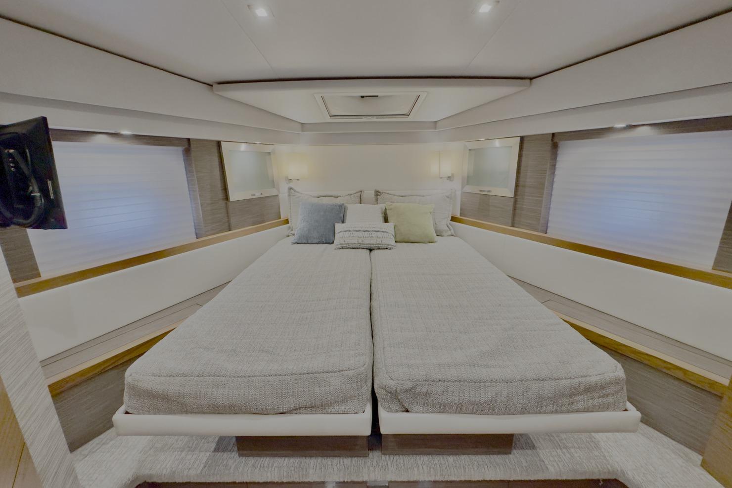 Luxurious bedroom interior of 2020 Tiara Yachts F53 Flybridge with modern design.