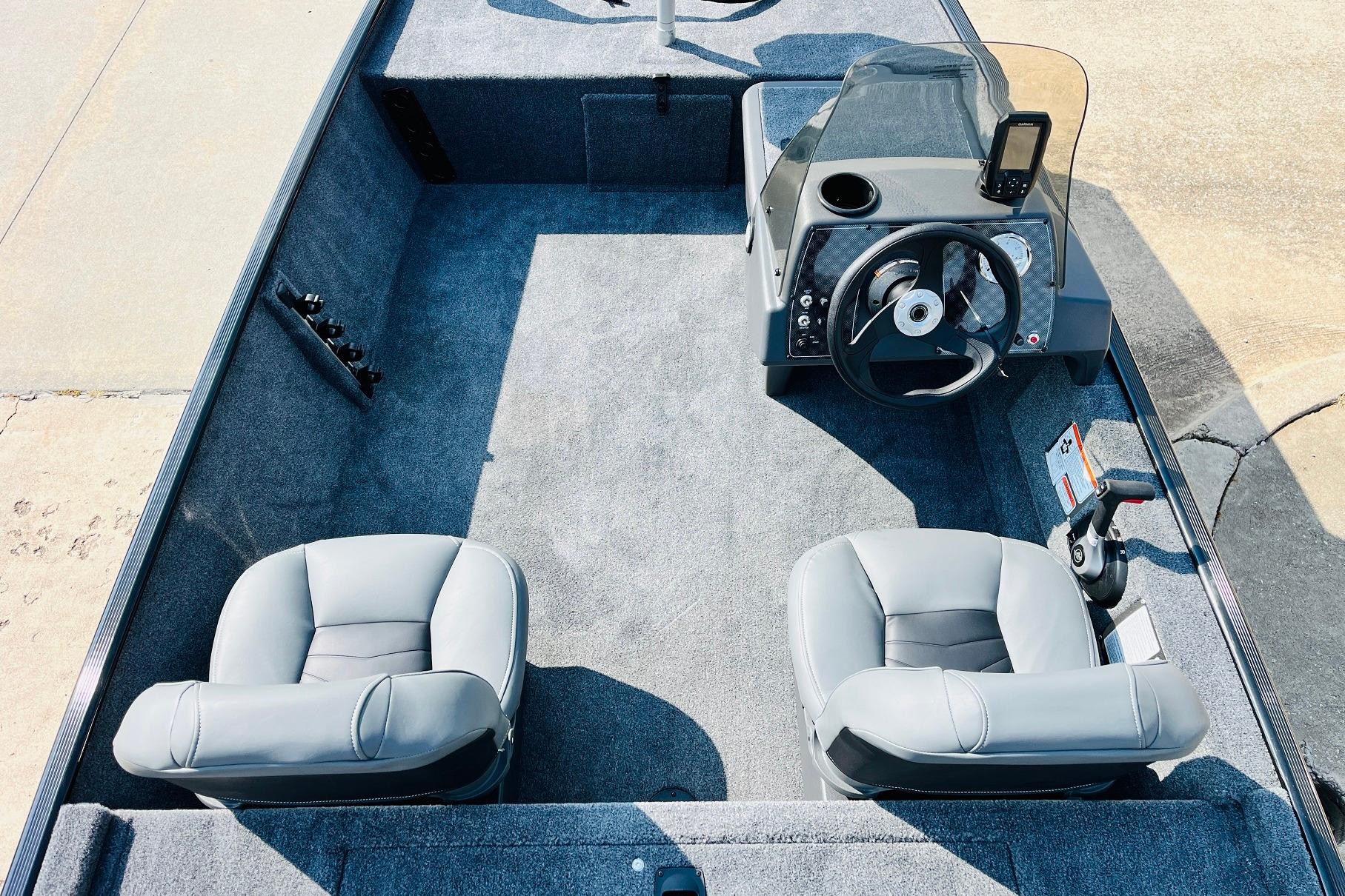 2026 Tracker Bass Tracker Classic XL boat interior with steering console and two seats.