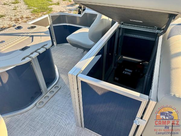 2025 South Bay 224FCR LE pontoon boat interior with storage compartments.