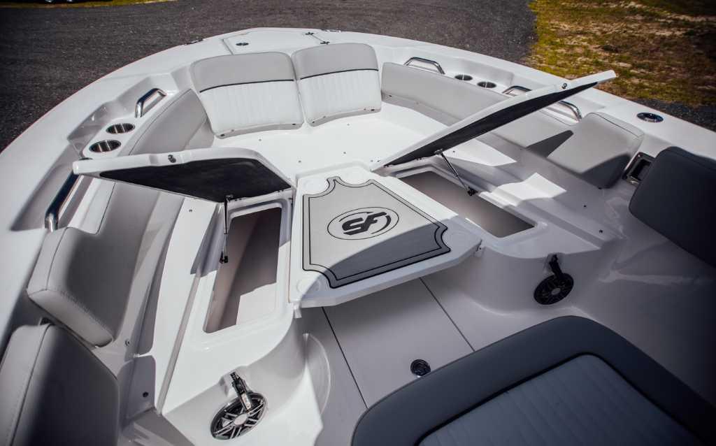 2021 Sea Fox 248 Commander boat interior with seating and storage compartments.