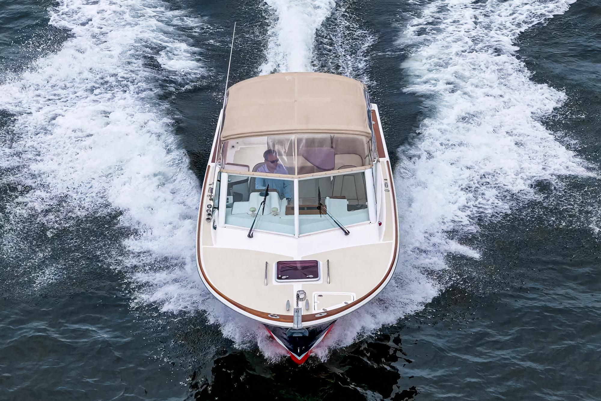 2006 Hunt Yachts Harrier 25 cruising on open water, top view.