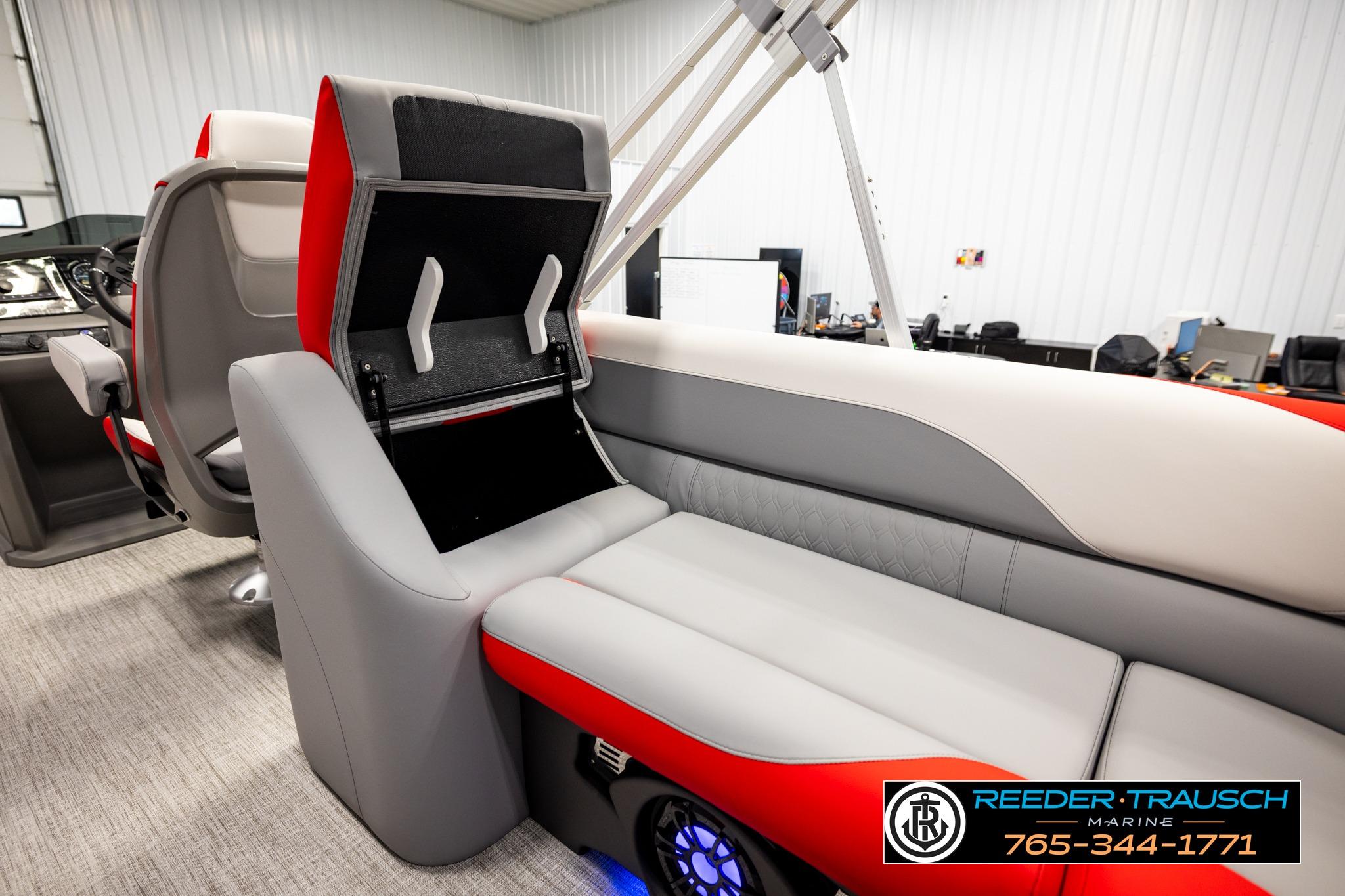 Luxurious interior of 2026 Avalon LSZ QL boat with red and gray seating.