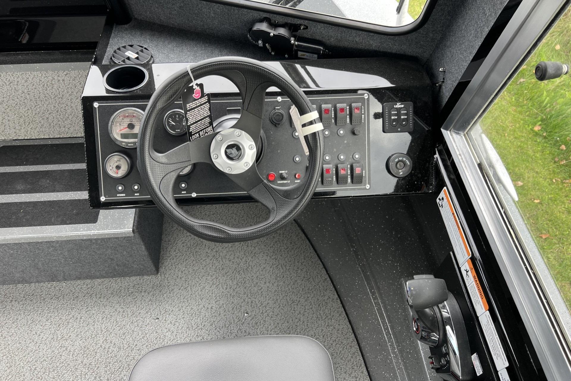 2024 Spartan 220 Maximus dashboard with steering wheel and control panel.