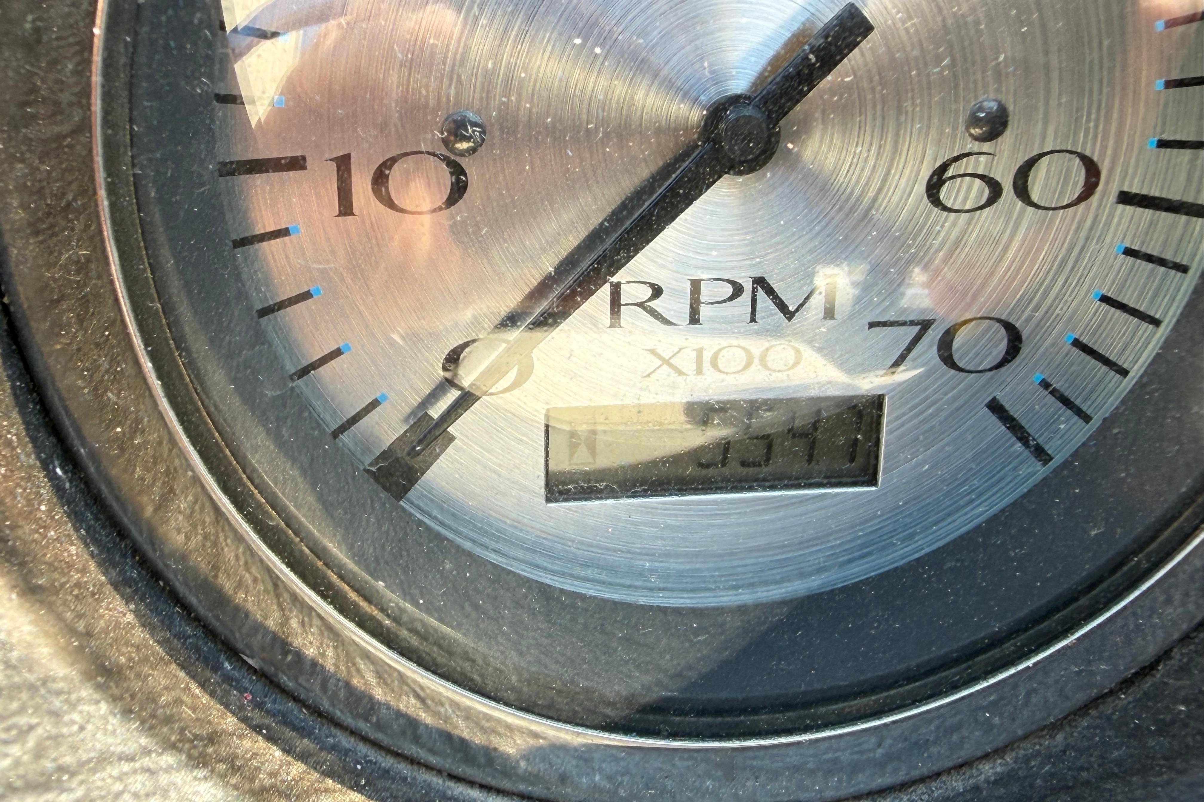 Close-up of a tachometer showing a reading of 3510 RPM.