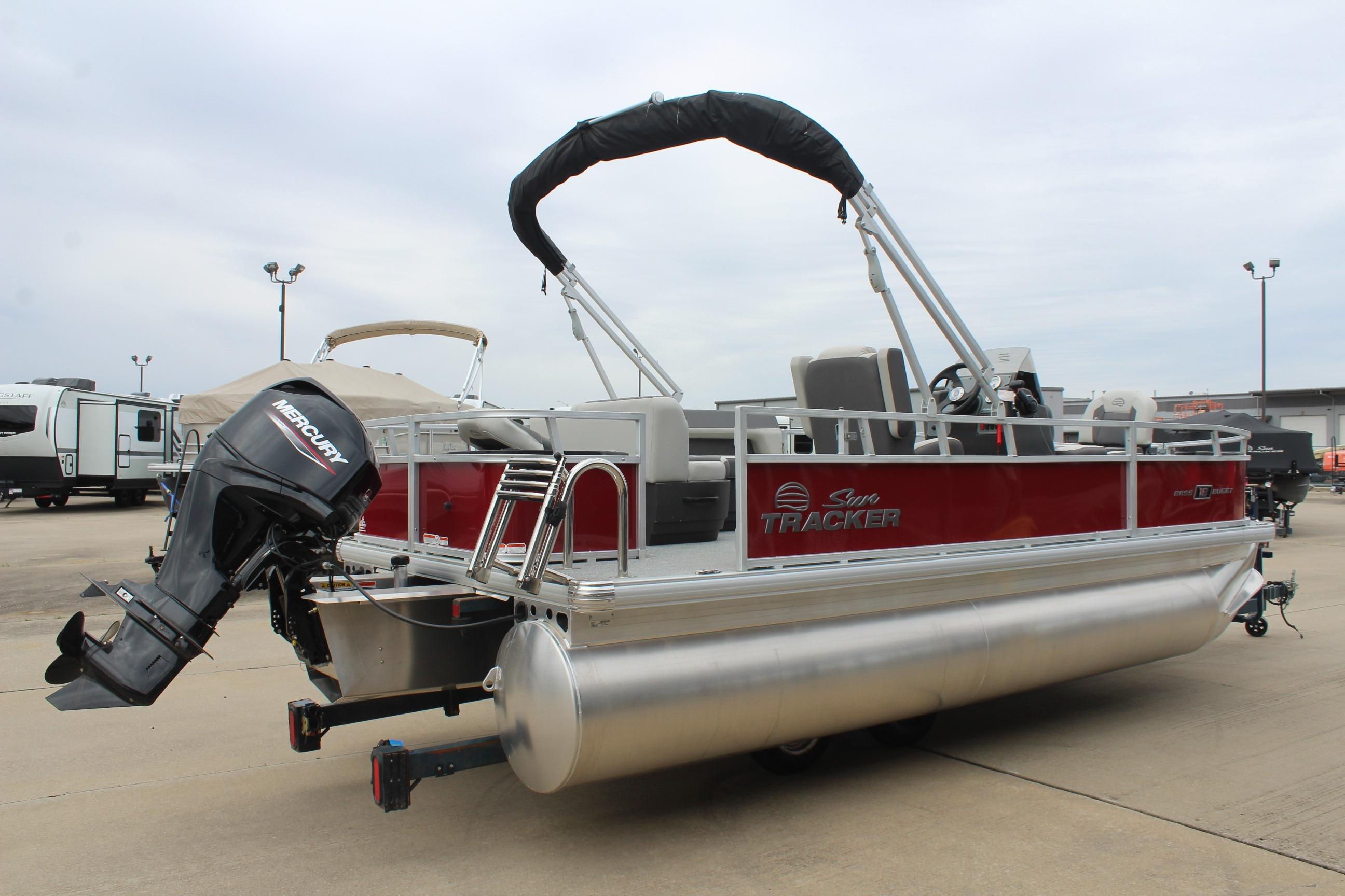2026 Sun Tracker Bass Buggy 18 DLX pontoon boat with Mercury outboard motor.