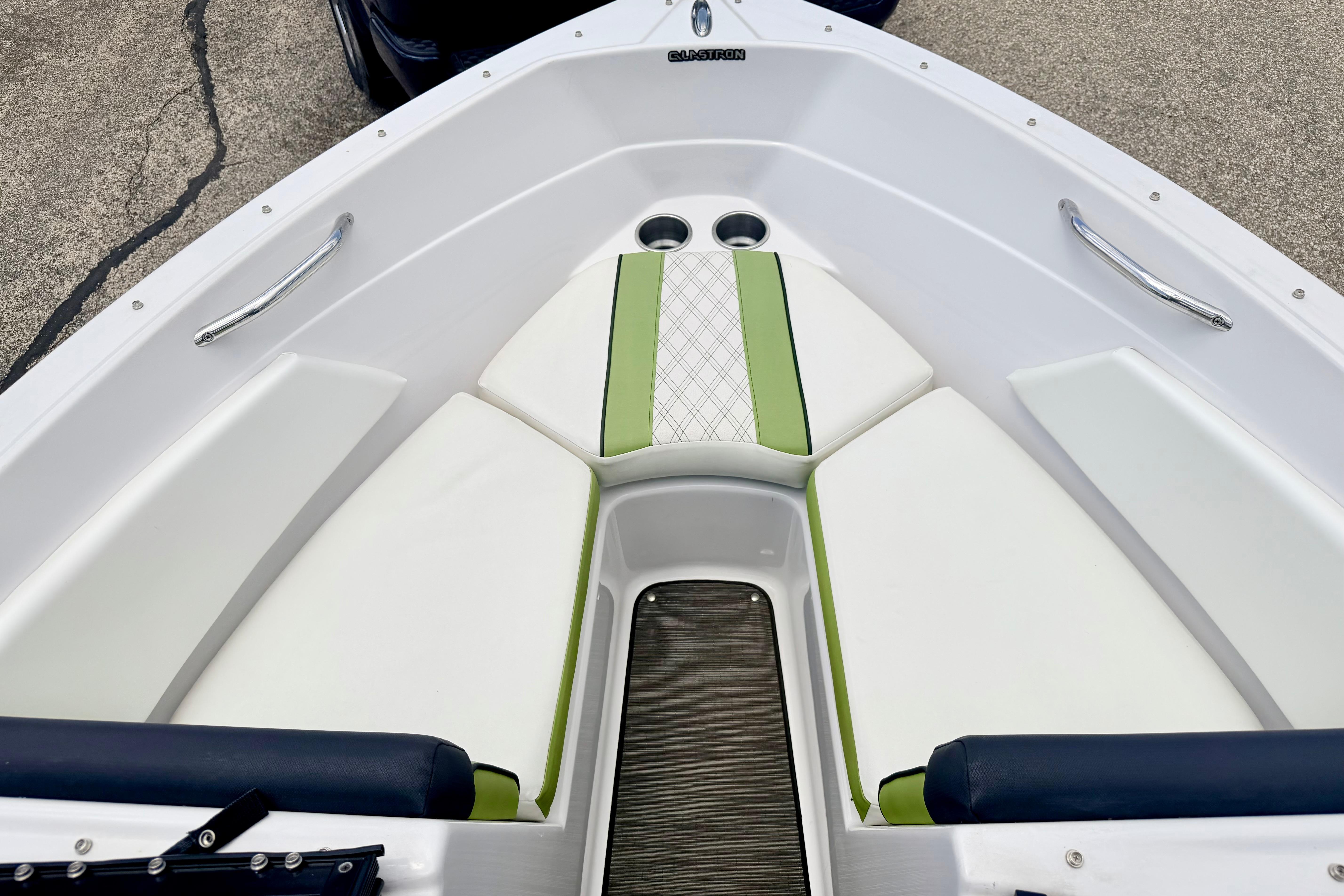 2018 Glastron GT 185 boat interior with white and green seating.