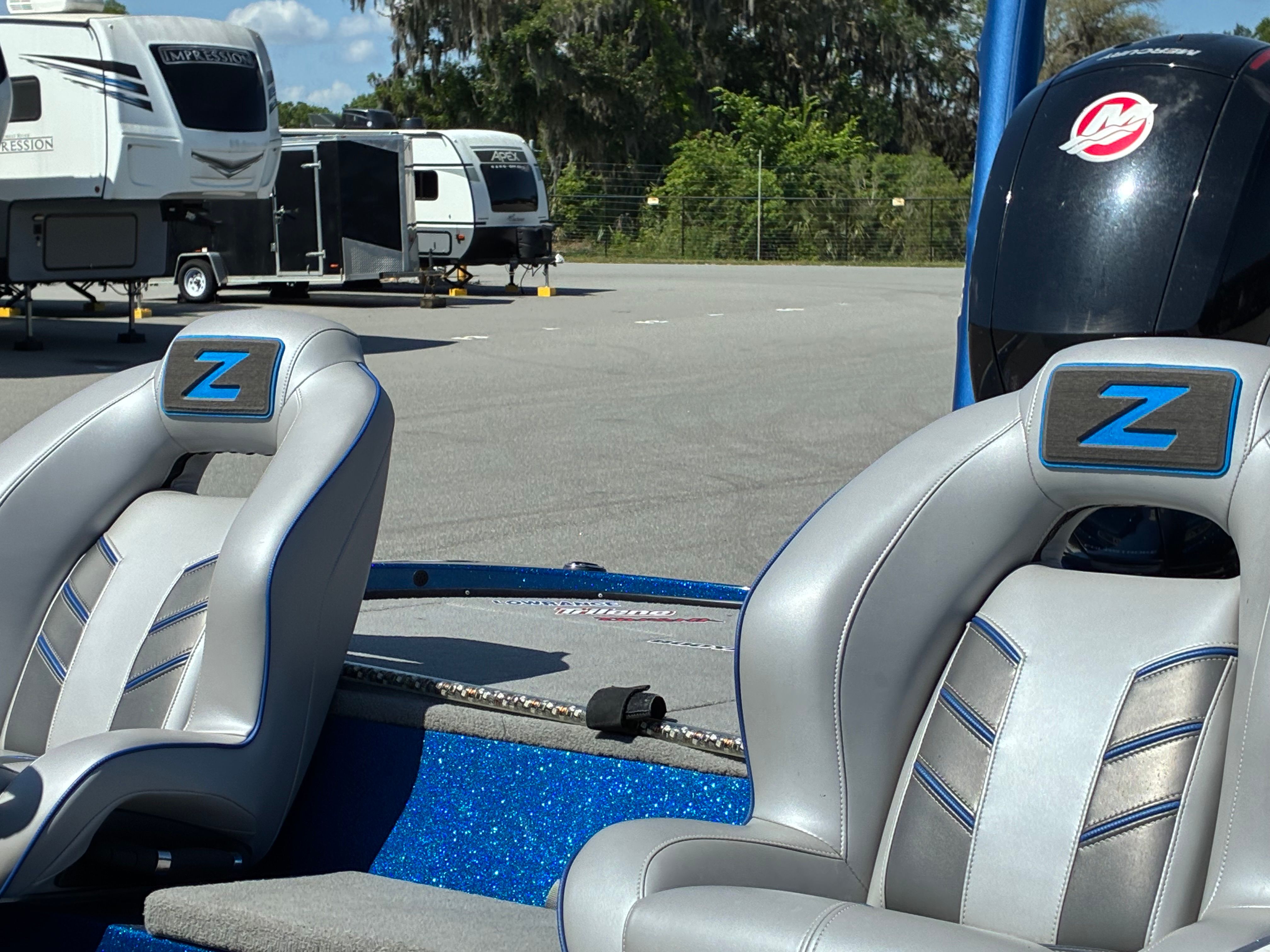 2024 Nitro Z18 Pro boat with gray seats in parking lot.