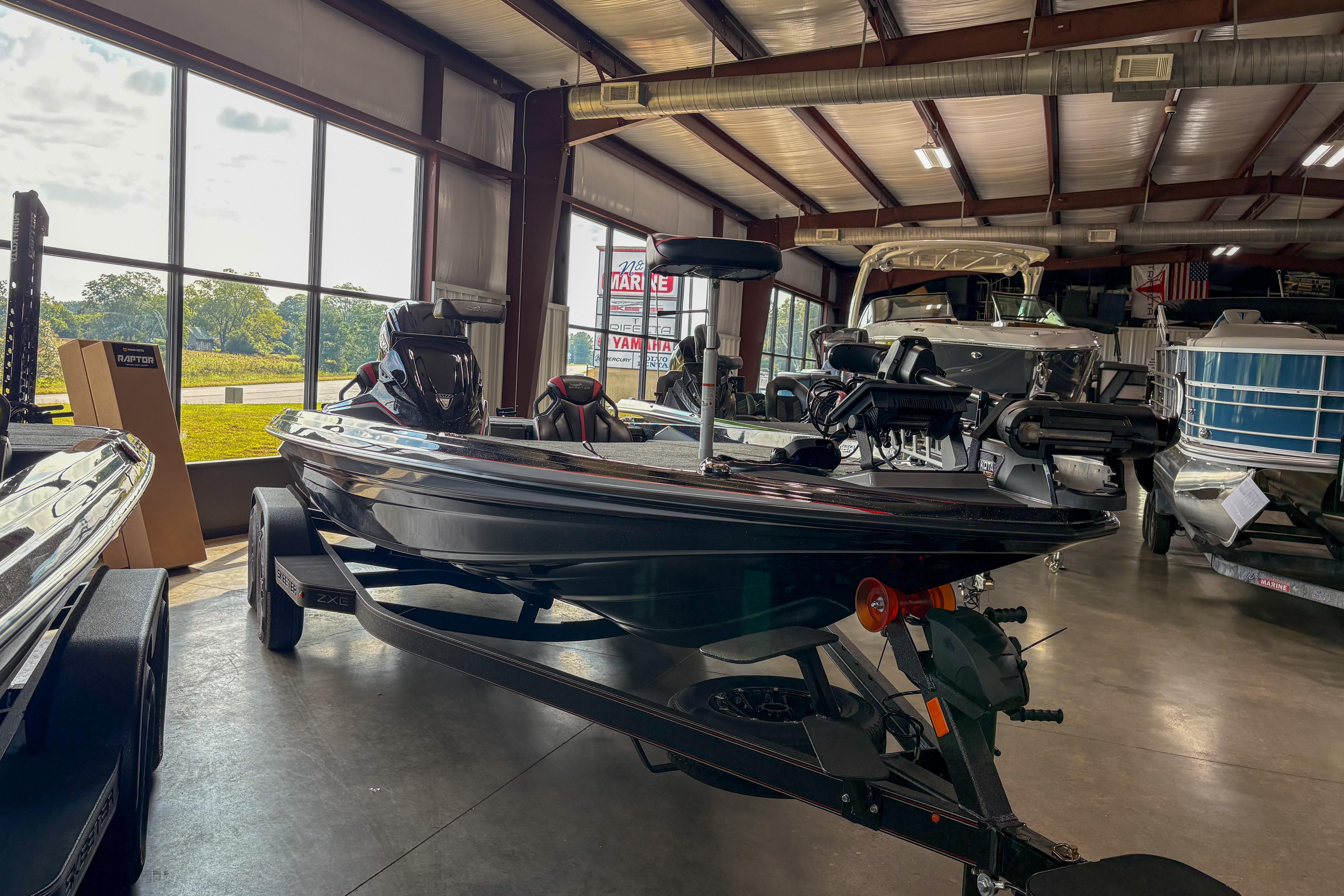 2026 Skeeter ZXE20 boat displayed in a showroom with large windows.