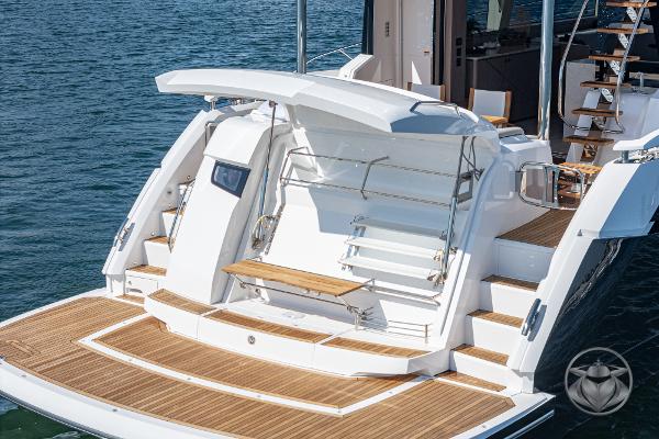 2025 Sunseeker Manhattan 68 yacht with elegant teak deck and modern design.