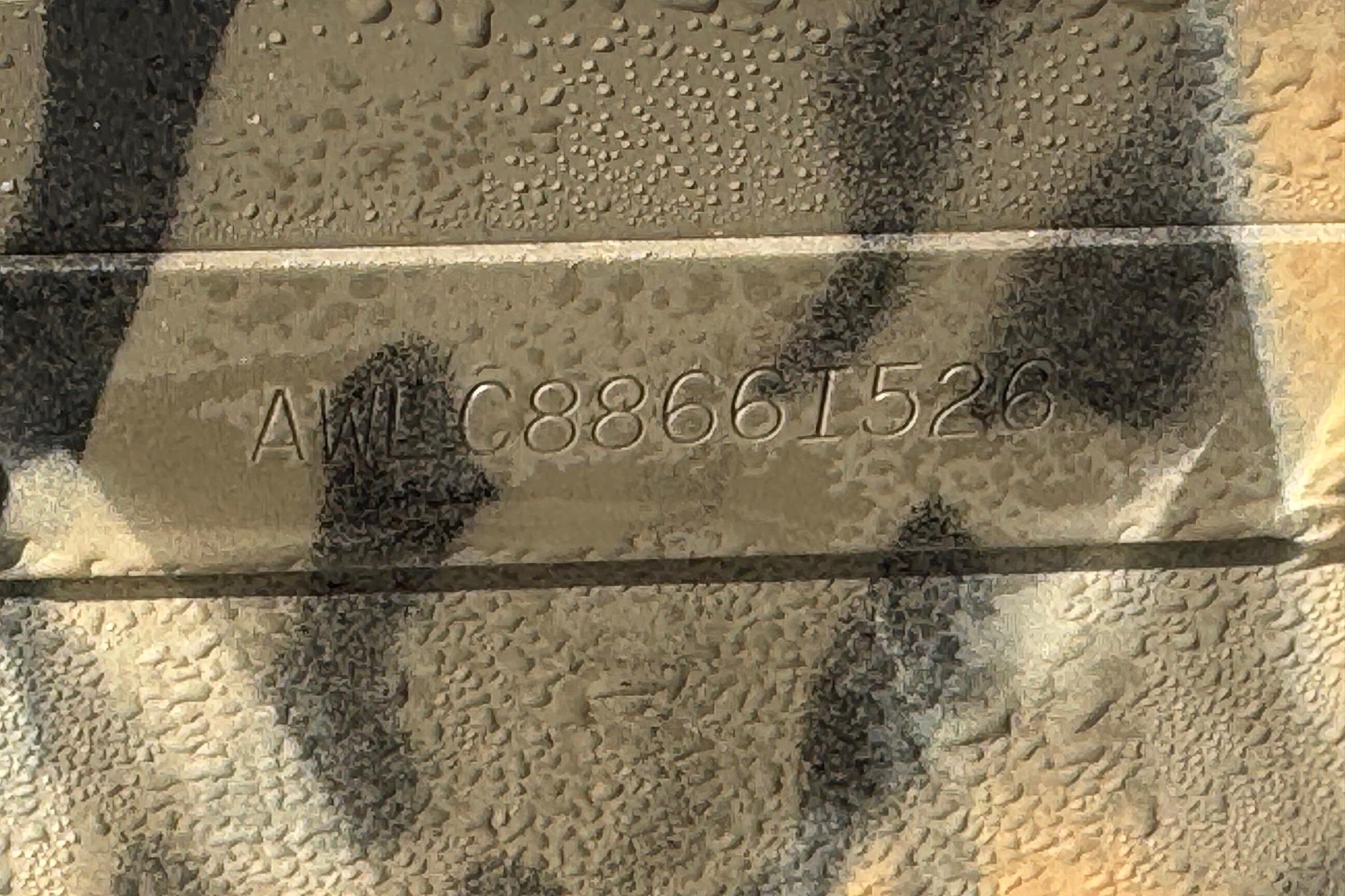 Hull identification number on 2026 Alweld 1652VV Marsh boat, wet surface.