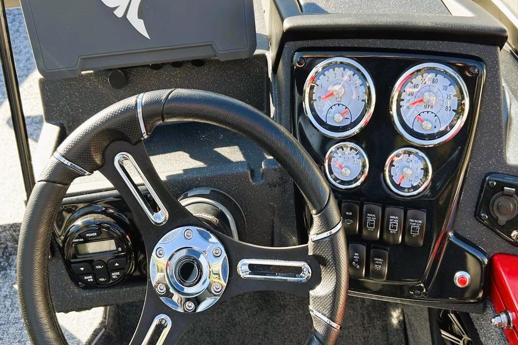 2026 Tracker Targa V-19 Combo dashboard with steering wheel and instrument gauges.