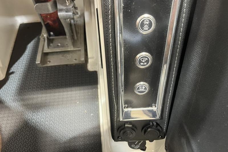 Control panel of 2022 Ranger Z520R boat with switches for lights, bilge, and livewell.
