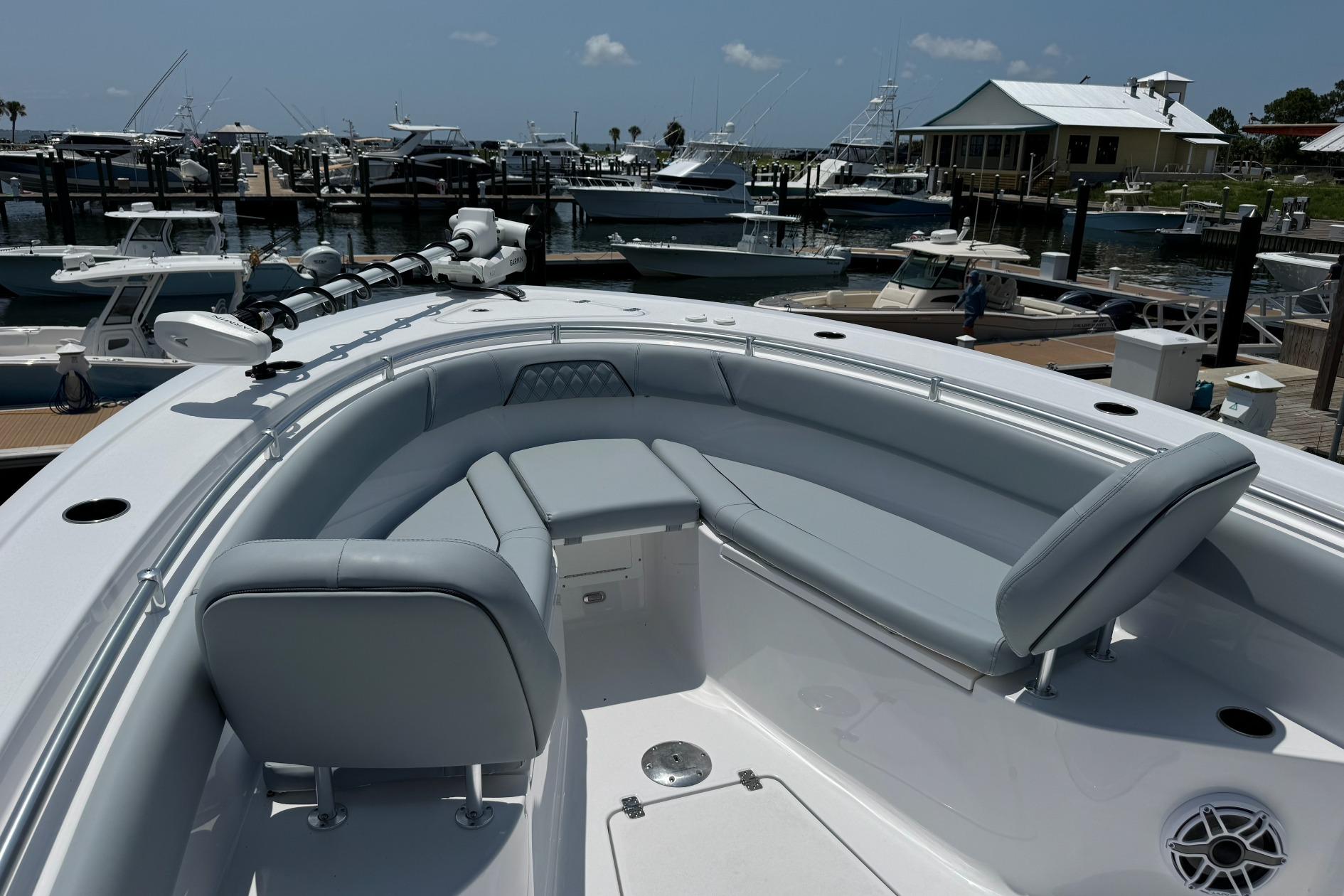 2026 Sportsman Open 262 Center Console boat with sleek seating at a marina.
