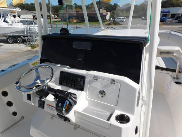 2024 Sailfish 242 CC boat console with steering wheel and controls.