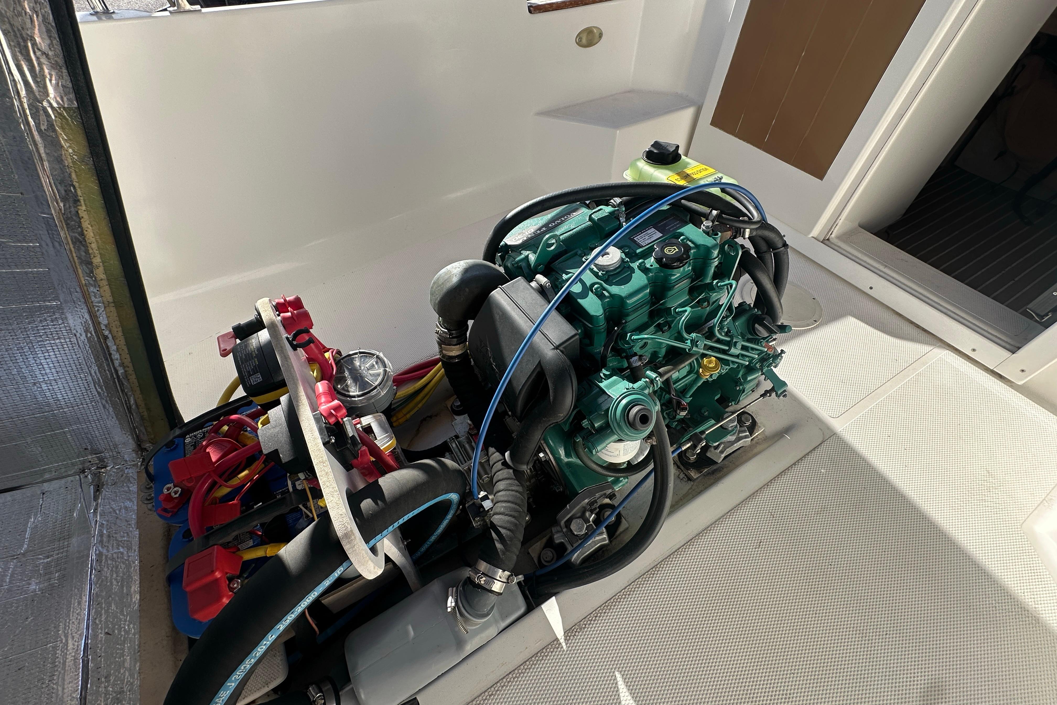 Engine compartment of a 2015 Ranger Tugs R-21 EC boat, showcasing detailed machinery.