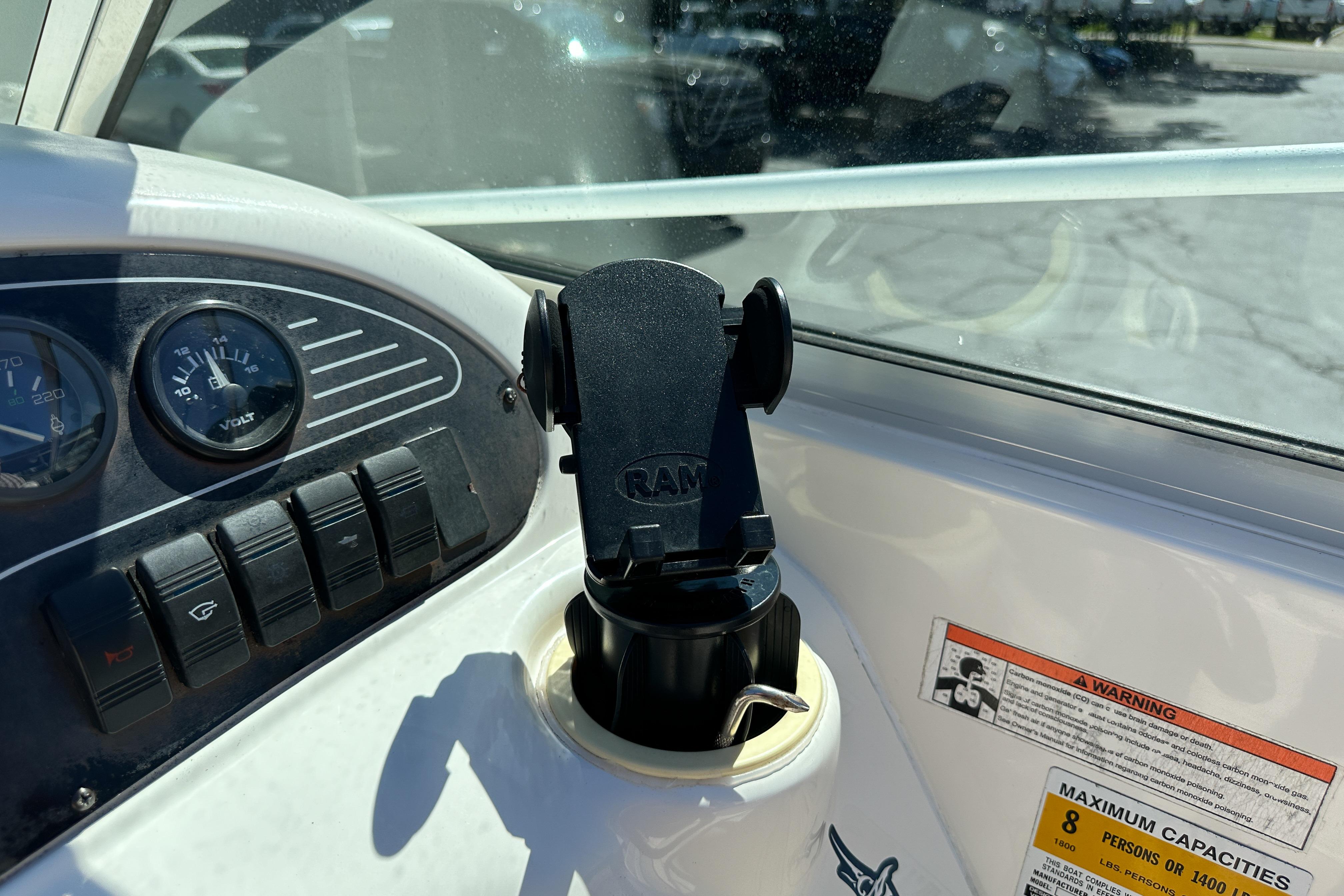 1998 Sea Ray 215 Express Cruiser dashboard with gauges and RAM mount holder.