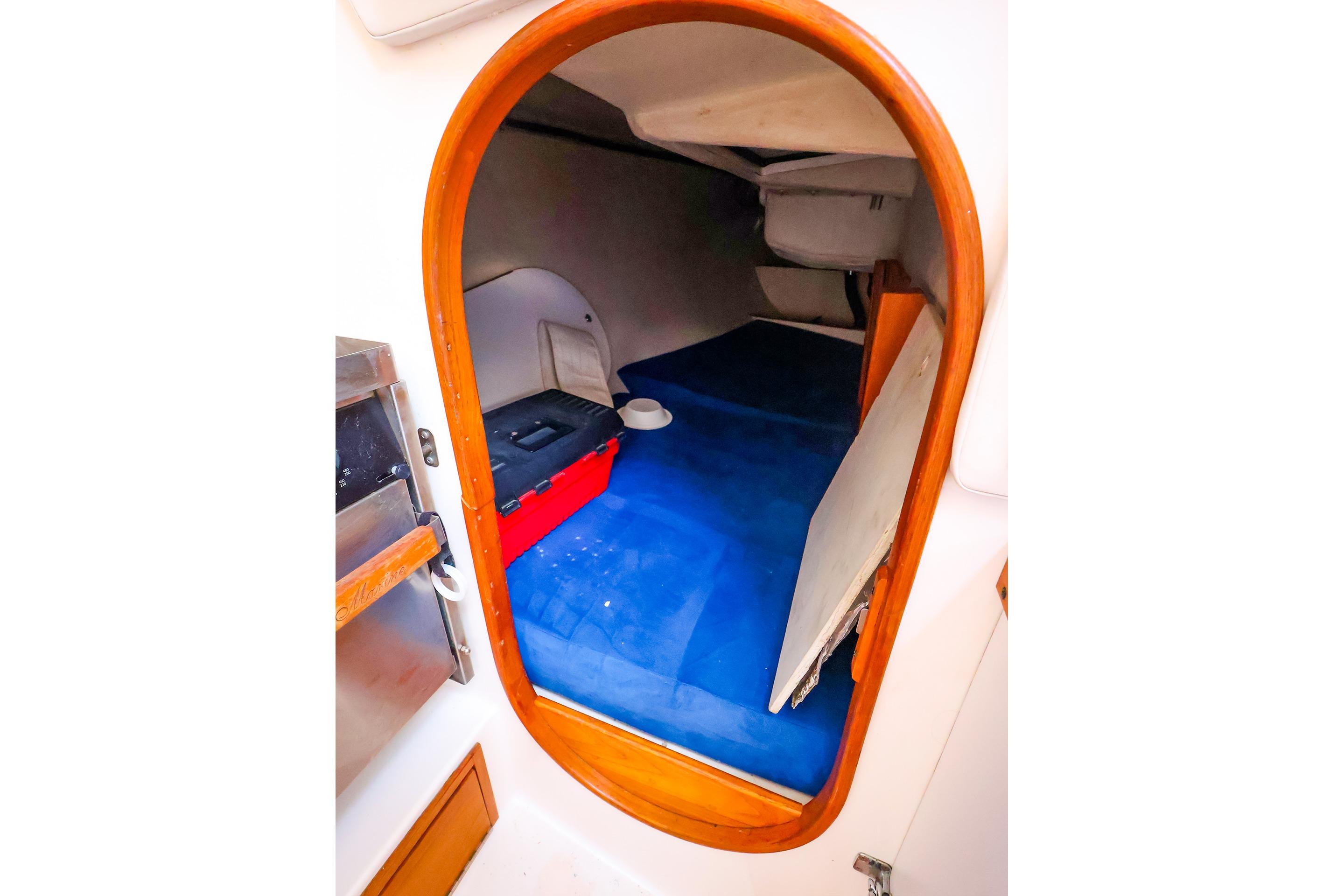 Interior cabin view of a 2001 J Boats J/32 sailboat, featuring a cozy sleeping area.