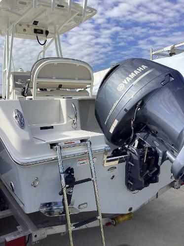 2022 Sailfish 220 CC boat with Yamaha outboard motor and ladder.