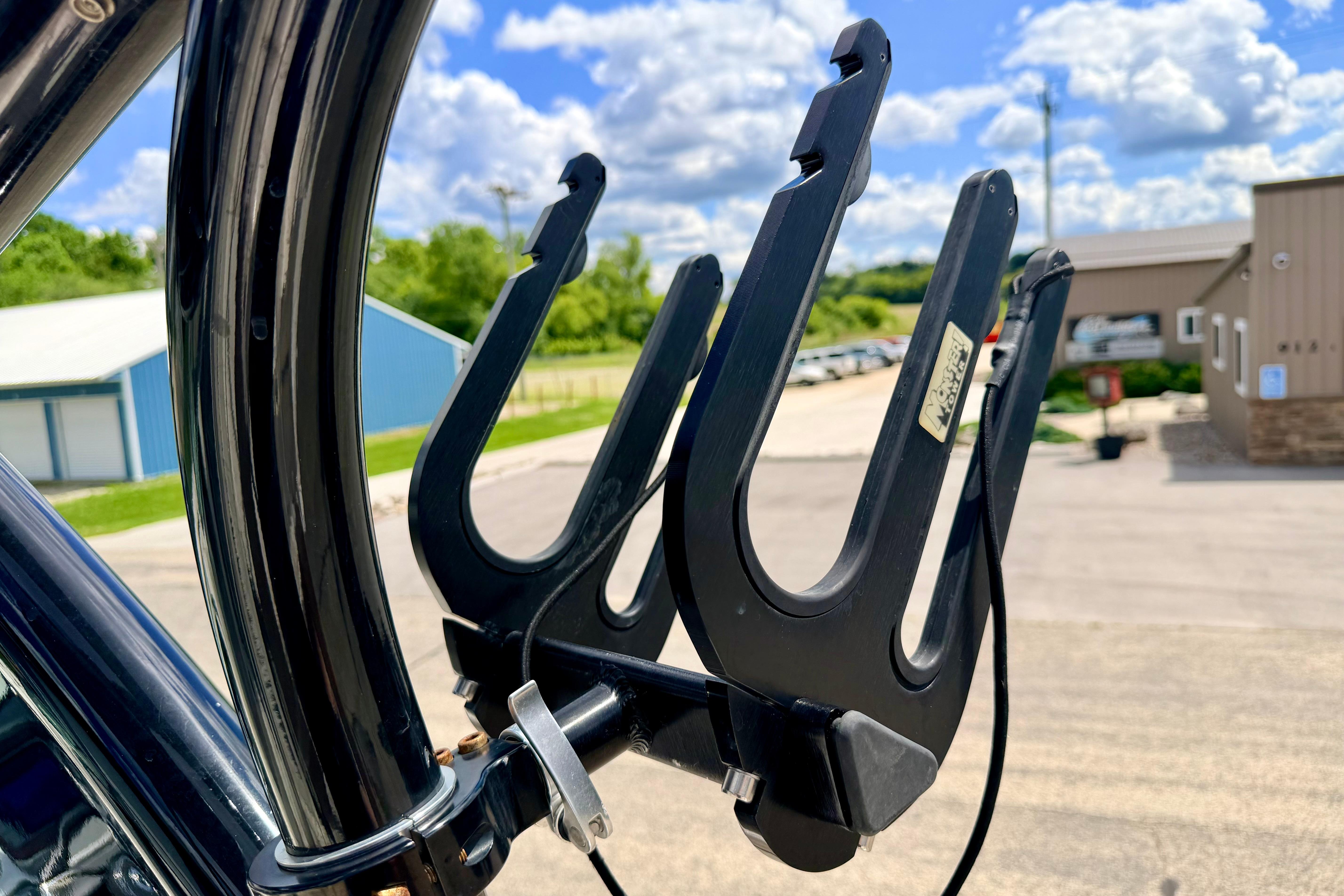 Wakeboard rack on a 2015 Chaparral Sunesta 264 boat under a blue sky.