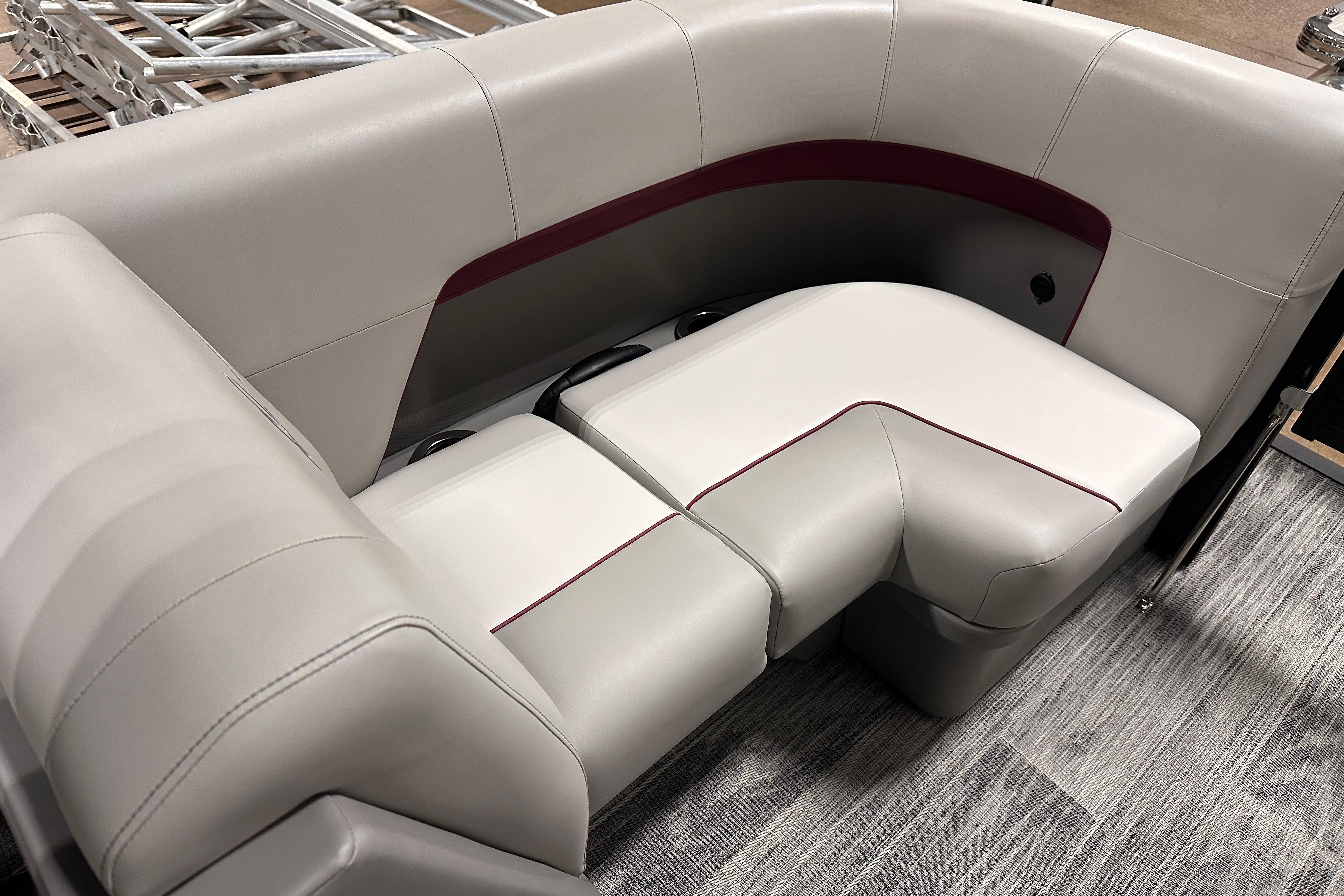 Luxurious seating on 2025 Qwest 18 XRE Cruise boat, featuring elegant upholstery and modern design.