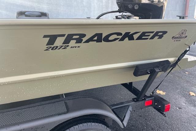 2026 Tracker Grizzly 2072 CC boat on trailer, side view.