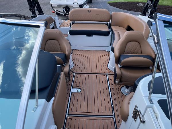 2024 Crownline Eclipse E255 boat interior with luxurious seating and teak flooring.