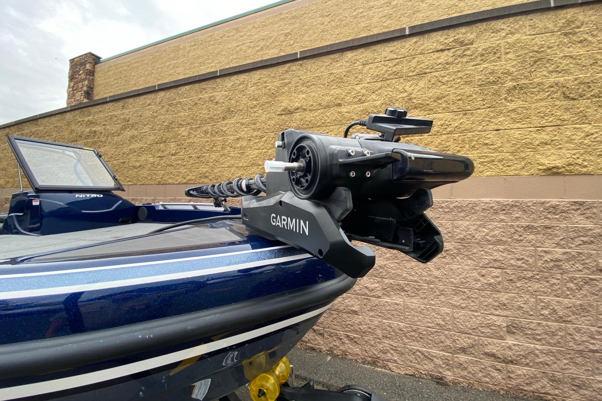 2026 Nitro ZV19 Pro boat with Garmin trolling motor, parked near a brick wall.