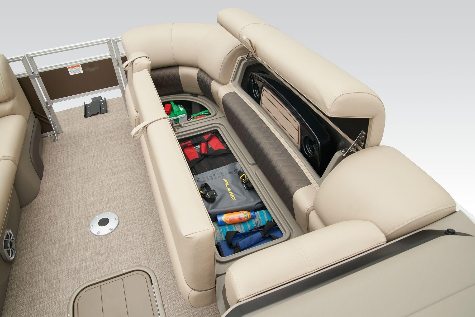 2023 Sun Tracker SportFish 22 XP3 boat interior with open storage compartments.