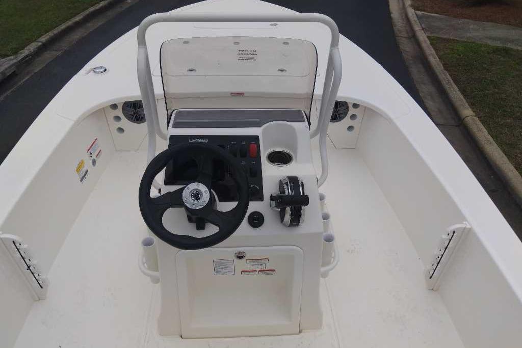 2026 Mako 18 Pro Skiff boat interior with steering wheel and control panel.