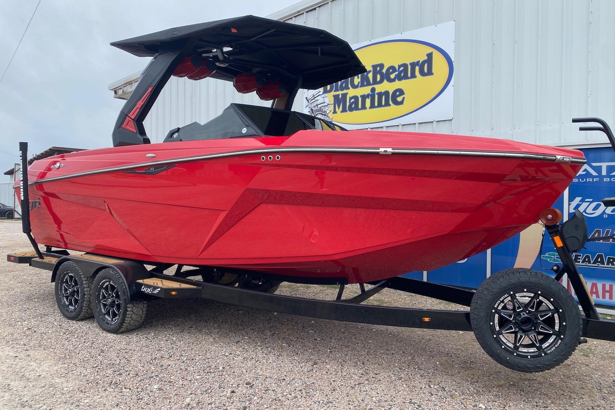 2026 Tigé Z3 boat in vibrant red on a trailer at BlackBeard Marine.