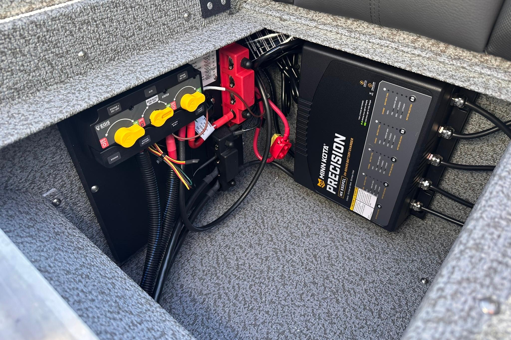 Electrical system of 2026 Lund 1875 Impact XS SS boat with Minn Kota Precision charger.