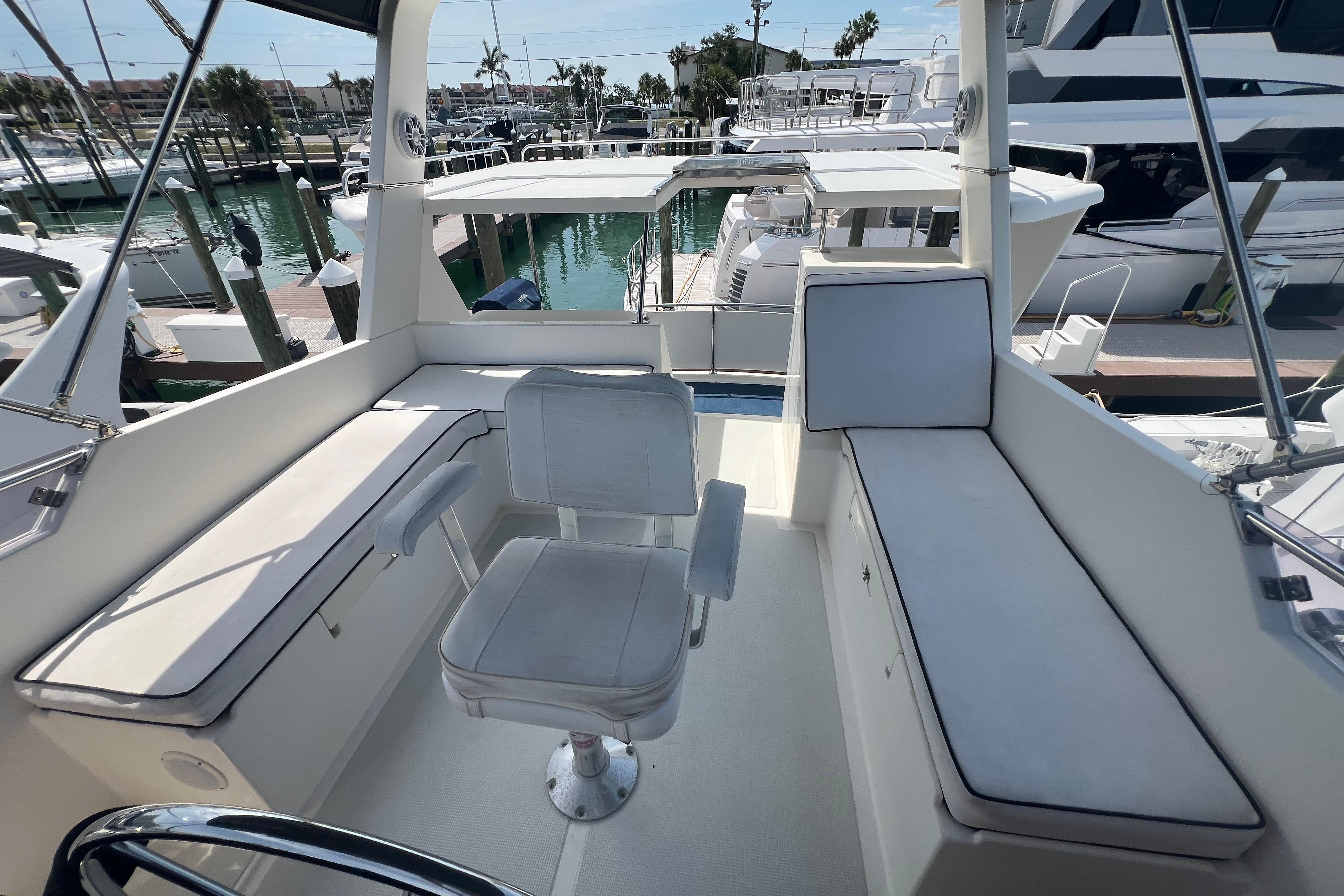 2007 Heritage East 36 Sundeck Trawler interior with seating and marina view.