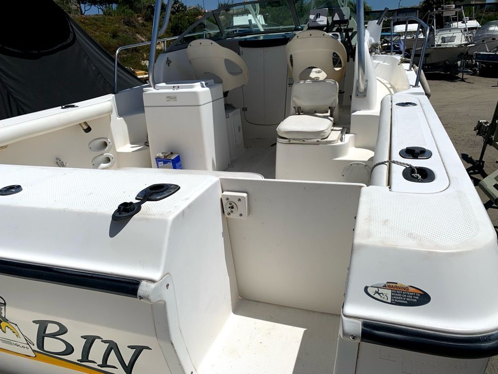 The image shows the cockpit of a 2003 Bayliner Walk Around Cuddy Cabin boat.